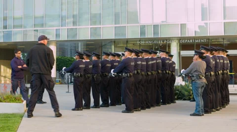 LAPD headquarters with cadets lined up with guns in Downtown LA HD Stock Footage 62272694