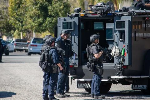 A LAPD SWAT team responds to a barricaded gunman in Reseda, CA. Stock Photos