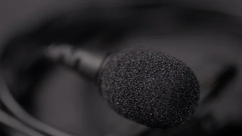 Lapel mic with wires rotating medium closeup 4k Stock Footage 107865927