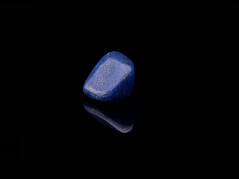 Lapis Lazuli gemstone rotating black surface Stock Footage 73234963
