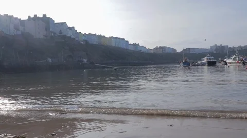 Lapping water on a beach pan left to right Stock Footage 116471235
