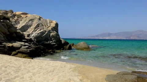 Lapping waves and the view of the clear turquoise waters of Aegean sea Naxos Stock Footage 130185048
