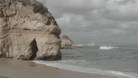 Lapping Waves on a Small Beach in Southern Portugal, Overcast Stock Footage 188588182