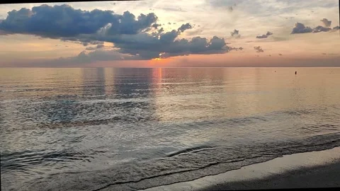 Lapping waves still calm beach sunset with sound Stock Footage 158499031