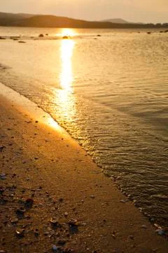 Lapping waves in the sun Stock Photos