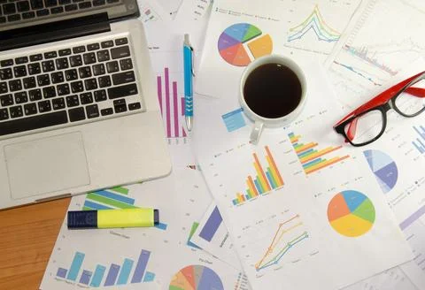 Laptob and graphs Stock Photos
