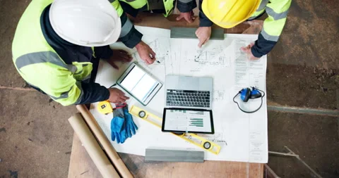 Laptop, above and men with blueprint for construction, layout and compliance Stock Footage 338106907