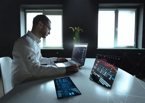 Laptop with abstract forex chart. Digital graph rising and falling, device Stock Photos