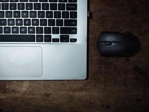 Laptop and black mouse Stock Photos