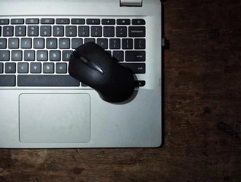 Laptop and black mouse Stock Photos