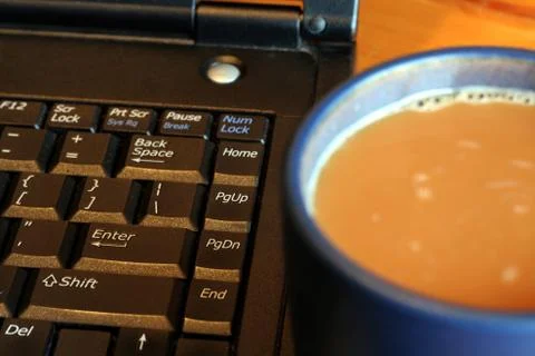 Laptop and coffee Stock Photos