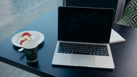 Laptop And Coffee On A Table At A Cafe Stock Footage 155462084