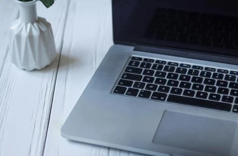 Laptop and documents in the workplace Stock Photos