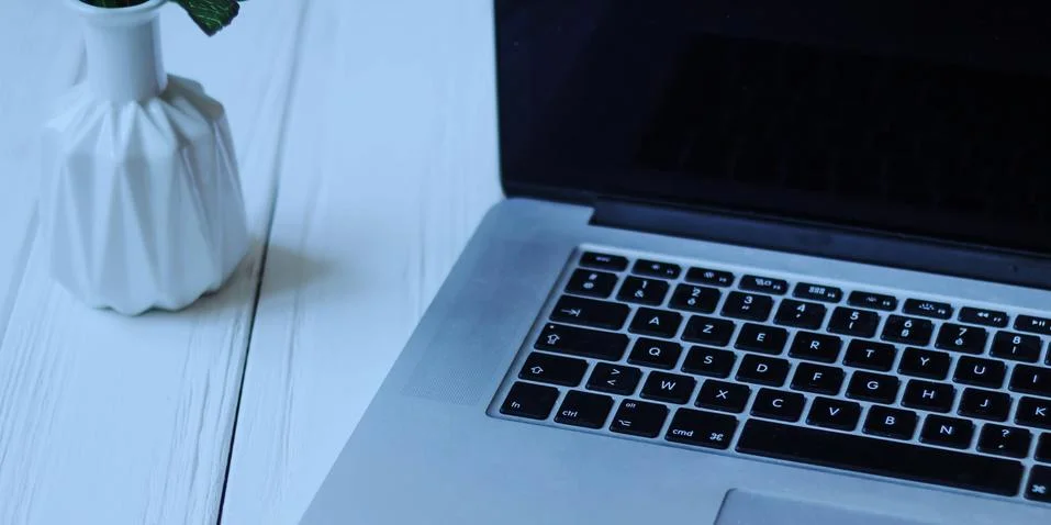 Laptop and documents in the workplace Stock Photos