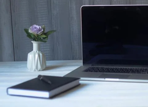 Laptop and documents in the workplace. Stock Photos