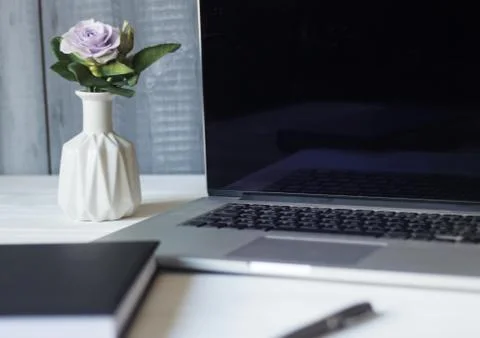 Laptop and documents in the workplace. Stock Photos