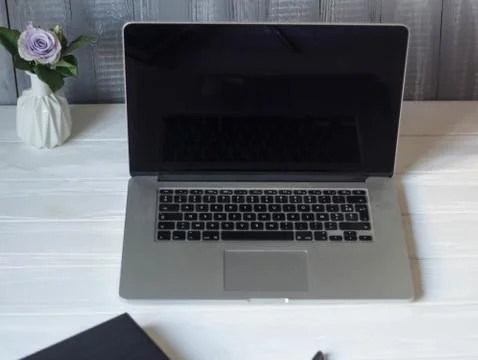 Laptop and documents in the workplace. Stock Photos