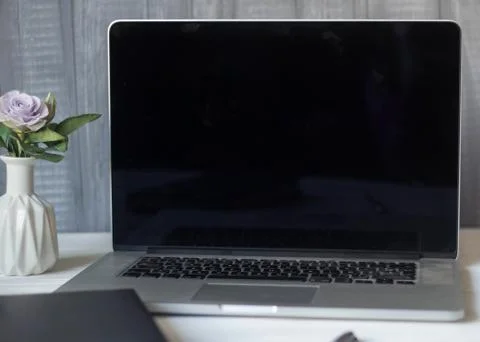 Laptop and documents in the workplace. Stock Photos