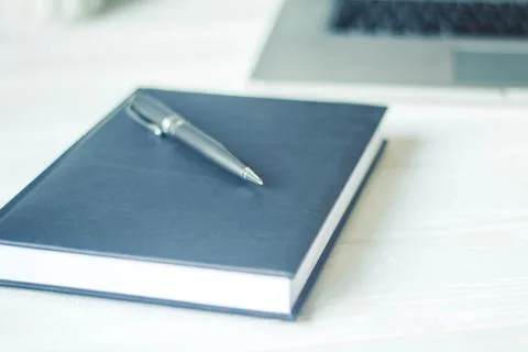 Laptop and documents in the workplace. Stock Photos