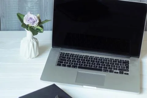 Laptop and documents in the workplace. Stock Photos