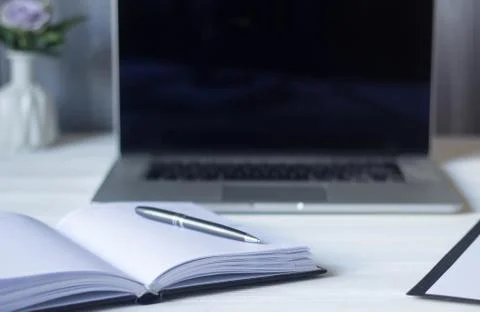 Laptop and documents in the workplace. workplace of business women Stock Photos