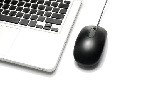 Laptop and mouse Stock Photos