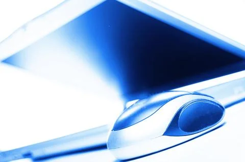 Laptop and mouse Stock Photos