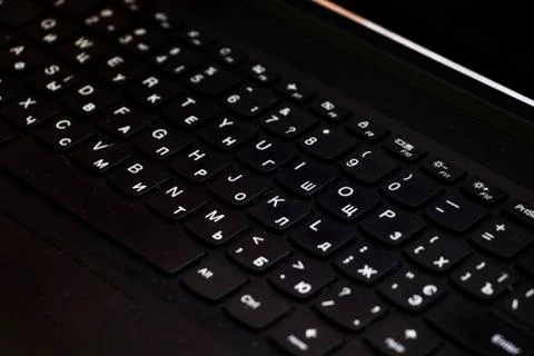 Laptop and notebook computer keyboard close up, texts, keys and black board. Stock Photos