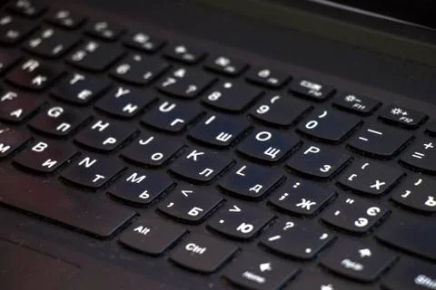 Laptop and notebook computer keyboard close up, texts, keys and black board. Stock Photos