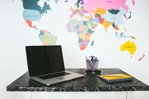 Laptop and notebook on the table. Stock Photos
