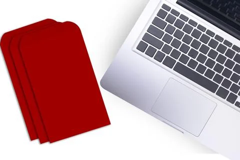 Laptop and stack of red envelopes (Angpao) 写真素材