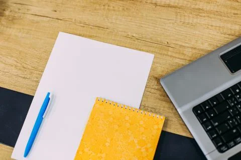 Laptop and writing instruments Stock Photos