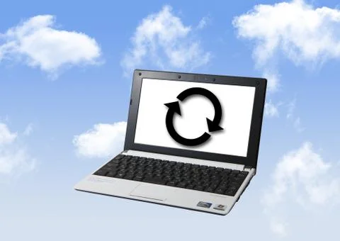 Laptop with arrow points on screen and blue sky Stock Photos