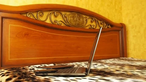 Laptop in the bedroom. Stock Footage