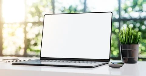 Laptop with blank frameless screen mockup template on the table in industrial Ilustración de archivo