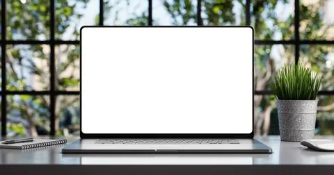 Laptop with blank frameless screen mockup template on the table in industrial Ilustración de archivo