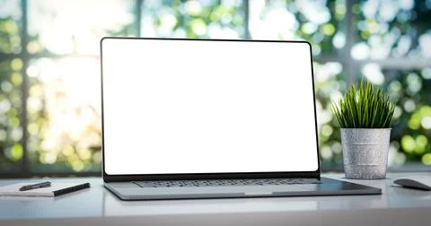 Laptop with blank frameless screen mockup template on the table in industrial Ilustración de archivo