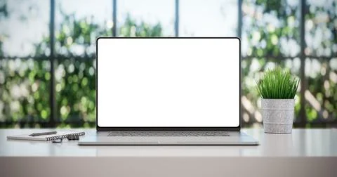 Laptop with blank frameless screen mockup template on the table in industrial Ilustración de archivo