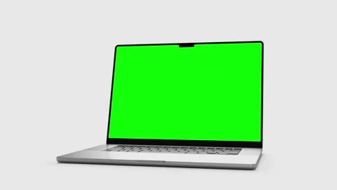 Laptop with a blank green screen  the computer falls down, bounces off the .. Stock Footage 299401888