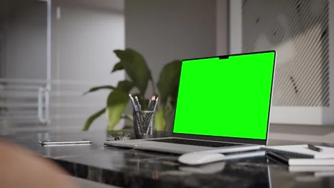 Laptop blank green screen mockup in a modern executive office interior and na Stock Footage 337987158