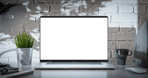 Laptop blank modern frameless screen in a loft industrial office interior wit Stock Illustration