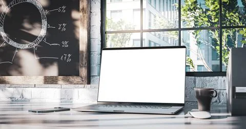 Laptop with the blank screen on the office table. Window with trees in the ba 스톡 일러스트