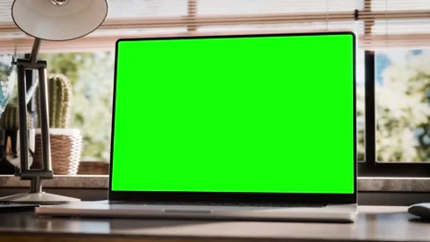 Laptop with a blank screen is placed on a stylish wooden desk within a loft.. Stock Footage 272611299