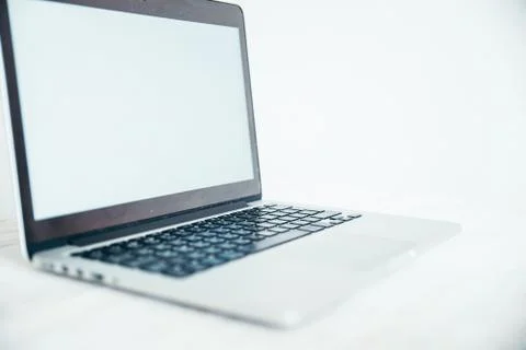 Laptop with blank screen on table Foto stock