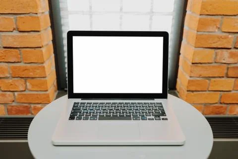 Laptop with blank screen on table Foto stock