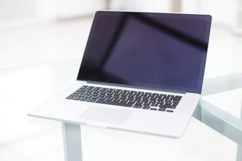 Laptop with blank screen on table. Stock Photos