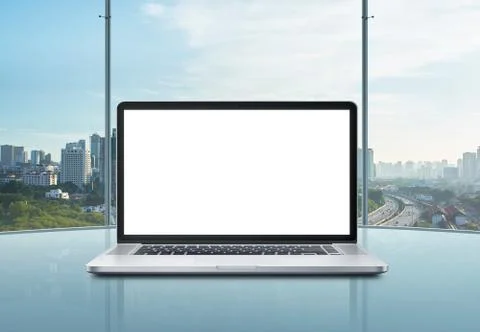 Laptop with blank screen on table. Stock Photos