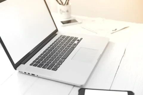Laptop with blank screen on table.. Stock Photos