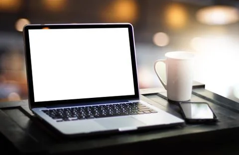 Laptop with blank screen on table. Workspace background new project on laptop Stock Photos