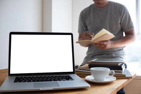 Laptop with blank screen on table. Workspace background new project on laptop 写真素材